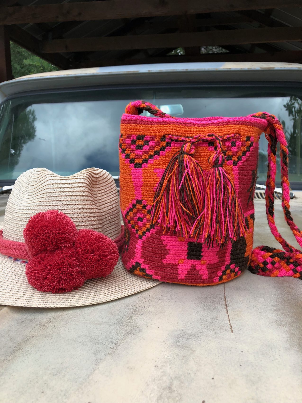 Crocheted Sling Bag in Black with Tassels from Colombia - Wayuu Charm |  NOVICA